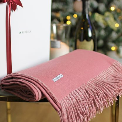 Pink alpaca blanket as a luxury gift for a woman
