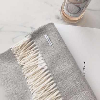 The most beautiful grey alpaca blanket with light fringes