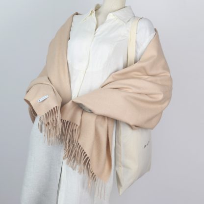 Wrap yourself in a beige alpaca blanket