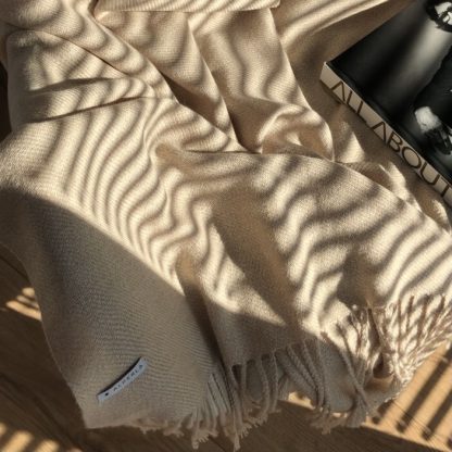 Sand color alpaca throw in the sunshine