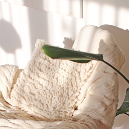 Decorative pillowcase made of alpaca pictured with El Carmen blanket